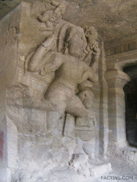 Four-armed doorkeeper - East Wing at Elephanta Caves
